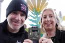 Fundraiser Bekki Fardoe (right) with Alan Lewis from Adrenaline Sporting Events with the medal for the Welshpool 10K.