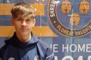 Haydn Lewis has joined Shrewsbury Town from Newtown.