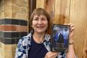 Kim Gravell with her new book, To Pay For The Crossing