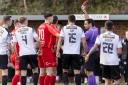 Bryn Markham-Jones issues a red card during Bala Town's clash against Flint based Connah's Quay Nomads