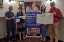 Mid and North Powys Mind received a share of £1,346 raised by Llandrindod Wells runners Fred Morris and Ffion Price.