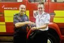 Station Manager Kerry Hughes awarding Crew Manager Paul Thomas with his medal.