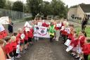 Fflori was cheered on by her classmates at Ysgol Llanbrynmair after completing her walking challenge for the Montgomeryshire Urdd Eisteddfod appeal