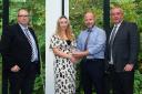 Phil Nicol receiving a Welsh Ambulance Service Award from  Director of Paramedicine Andy Swinburn, Megan Williams  and Michael Williams.