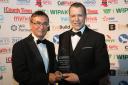 Councillor David Selby presents the Powys Business of the Year Award to Christian Smith from Radnor Hills.