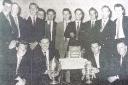 Players and officials of Caersws Football Club celebrate the Welsh Amateur Cup in 1961.