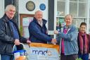 Richard Shackelford (second left) from the Motor Neurone Disease Association receives a cheque from Ron Skilton Memorial Half Marathon organising committee members Mike Thomas (left) and Bob and Karen Greenough.