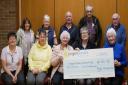 Dolfor Charity Group present a cheque for £1,200 raised from the annual charity concert to Ann Jones from the Lingen Davies Cancer Fund.