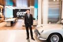 Series director Julian Jones at Aston Martin’s flagship showroom in London with James Bond’s iconic DB5