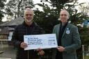 Builth mayor Mark Hammond receives a cheque from RWAS chief executive Aled Rhys Jones at the 2023 Winter Fair.