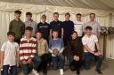 Jonathon Davies, pictured far right on the back row with members and graduates of Newtown Cricket Club’s junior section, for been named ECB Coach Of The Year For Wales,