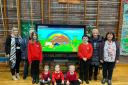 Caersws Primary School pupils and staff with the new smartboard.