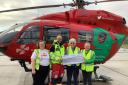 Caersws Whist Drive members Delma Thomas and Beryl Calvin-Thomas presented a cheque to paramedic Mike Aynslie and Flora Stanbridge, the lifesaving charity's representative, at its Mid Wales base on the outskirts of Welshpool in late November. 