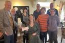Welshpool Community Haven receiving a donation in February 2023.