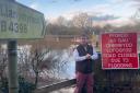 Montgomeryshire MP Craig Williams at a flood scene in Llanymynech.