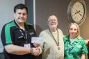 St John Ambulance Service trainers Dan Harper and Sindy Traylor, being presented with a cheque by Builth Wells Rotary Club president Ciaran O’Connell.