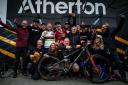 The Atherton Bikes team celebrating a World Championship win.
