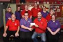 Rhayader Carnival committee members present a cheque to staff at Rhayader Community Nursery.