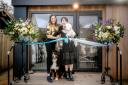 Kelly Davis and Lianne Ong with their dogs at the opening of KD Spa