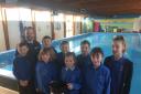 Hay school children with Co-op team manager Gareth Ratcliffe at Hay Swimming Pool during a previous fundraiser.
