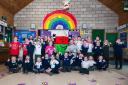 Irfon Valley Primary School pupils celebrate with Mr Urdd and ambassadors Euros and Jemima