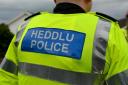 Dyfed-Powys Police is warning of a man purporting to be a police officer
