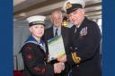 Ordinary Cadet Alfie Anderson receives his creative writing certificate.