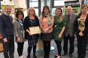 Investors in Carers Bronze Award for Milford Haven Library. From Left to right: Mike Cavanagh, Pembrokeshire County Council Head of Cultural, Leisure and Registration Services; Yoriko Omae (Library and Information Assistant); Maureen Sutton (Library and I