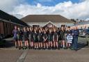 Rugby Coach Daley Jones and Wellbeing Officer Huw Williams with Welshpool high School Under 14s Rugby team.