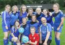Berriew Football Club's girls under 14's side with Paul Inns and Manchester United star Carrie Jones in 2019.