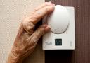 Embargoed to 0001 Friday December 28..File photo dated 19/11/14 of an elderly woman adjusting her thermostat.Pic: Peter Byrne/PA Wire.