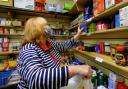 LLANIDLOES, POWYS Volunteer Pam Norris puts together food parcels. Volunteers at the Llanidloes food bank, Llani Pantri, photographed on Thuesday, October 14, 2021. Organisers say they are expecting an increase in footfall due to a cut in universal