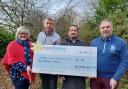 Lou Childs, Dai Ellis (Welshpool Golf Club Vice Captain), Martin Hughes (Club Chairman), and Clive Jones (Club Captain) with a cheque for £1,000 to the Lingen Davies Cancer Fund