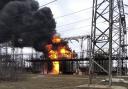 In this handout photo provided by Ukraine's Emergency Situation Ministry, flames and smoke rise from the thermal power plant, which, according to local authorities, was damaged by shelling, near the frontline in the town of Shchastia in the Luhansk