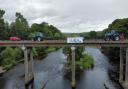 A banner is dropped from a bridge across the Wye in Hay last weekend