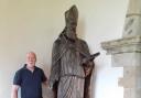 The statue of Bishop WIlliam Morgan, in St Dogfan's, pictured with sculptor Barry Davies