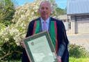 Tom Jones OBE, from Dolanog, with his honorary fellowship from Aberystwyth University in July 2022.