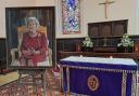 'The Enduring Monarch' by dan Llewelyn Hall, on display at St Myllin's Church alongside the Book of Condolence.