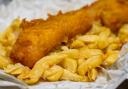 Traditional English jumbo sized Fish and Chips served in paper.