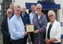 Aberystwyth Lifeboat Station present a memorial plaque to the family of Peter Martin Jones, of Newtown, who bequeathed £300,000 to the RNLI. Picture by RNLI.