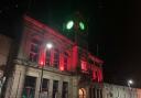 Welshpool Town Hall illuminated in red for the match.