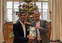 Russell George and Prime Minister Rishi Sunak at Chequers with the winning Christmas card design for 2022.