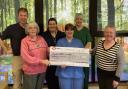 Caersws Whist Drive's Delma Thomas and Beryl Calvin-Thomas present a cheque for £500 to Llanidloes hospital staff including Dr David Moore, Sister Ellie Jolley-Dawson, healthcare assistant Sharon Brown and Vicky James.