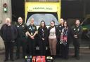 Kirsten Morrissey from Newtown (centre) with the ambulance crews who helped to save her life.