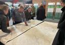 Members of the public pore over plans at an exhibition at the Royal Welsh Showground near Builth Wells in March