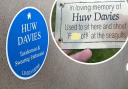 The blue plaque installed for Huw Davies, described as a 