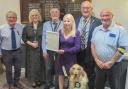 Pictured (l-r) are past Builth Rotary president Baden Powell, Guide Dogs Cymru representative Ruth Evans, Rotary president Ciaran O’Connell, Heather Gethin, Rotarians Richard Davies and Nigel Gethin and, of course, newest member Farley.