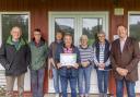 The Dolwen Field development committee celebrate the ‘outstanding’ status awarded in the RHS sponsored It’s my Neighbourhood Awards category.