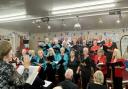 The combined choirs of Cor Llanwnog and The Wesley Singers under the baton of Stella Gratrix