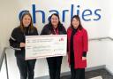 Charlies Stores Managing Director Rebecca Lloyd with cheque for the Air Ambulance, presented to Phae Jones and Debra Sima.